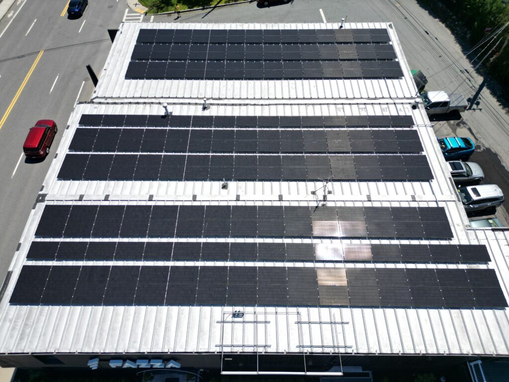 Overhead view of large commercial solar panel array by Alexa Energy Power Solutions