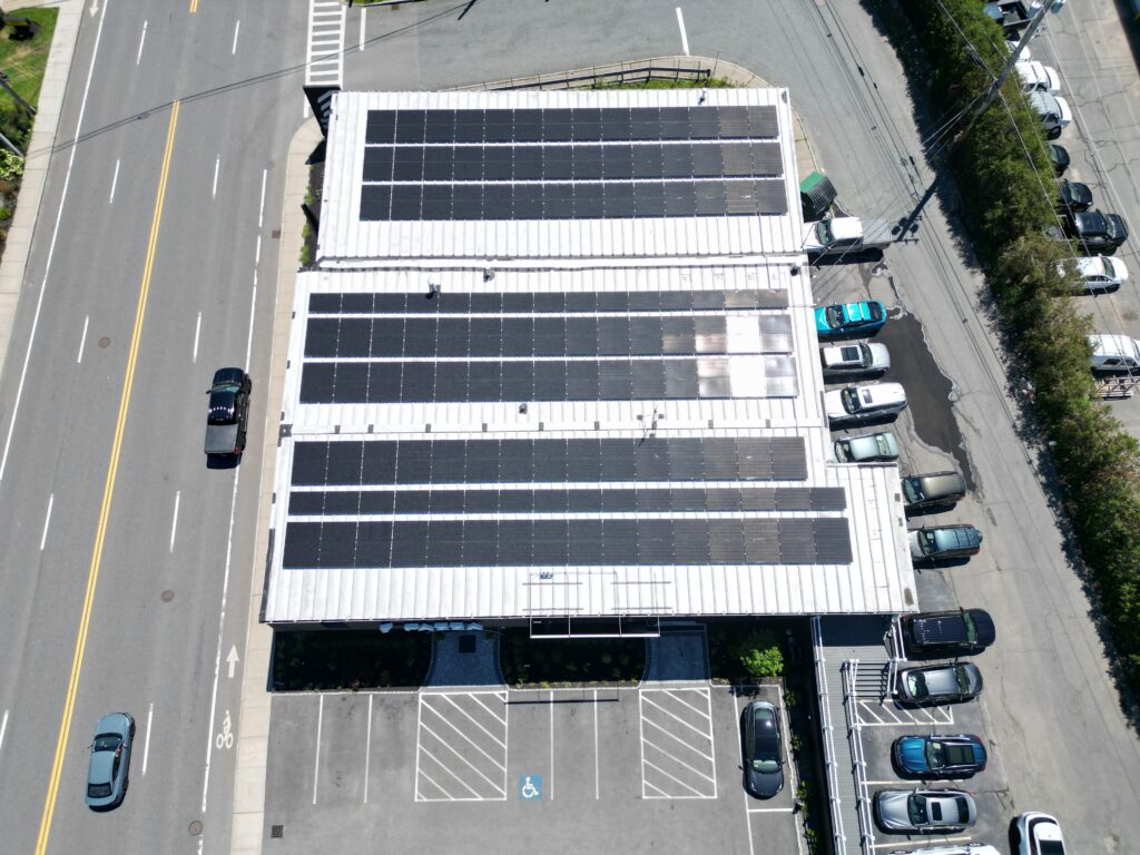 Aerial view of commercial rooftop solar installation by Alexa Energy Power Solutions