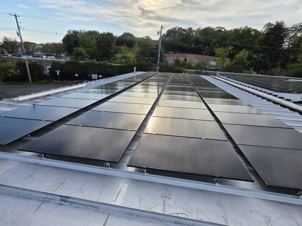 Close view of commercial rooftop solar array installed by Alexa Energy Power Solutions