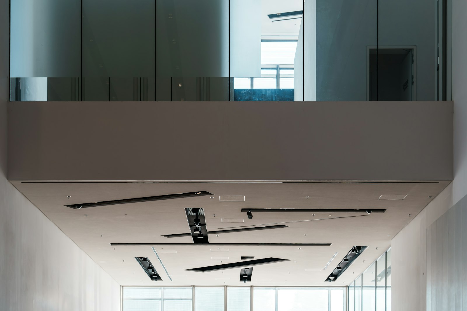 Modern commercial building hallway with ceiling lights