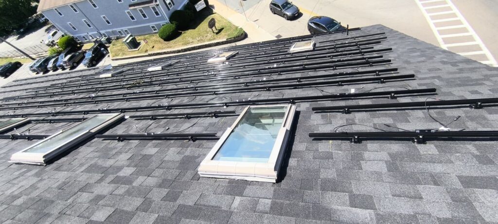 Solar racking laid out around skylights on the Fazza Commons roof by Alexa Energy Power Solutions