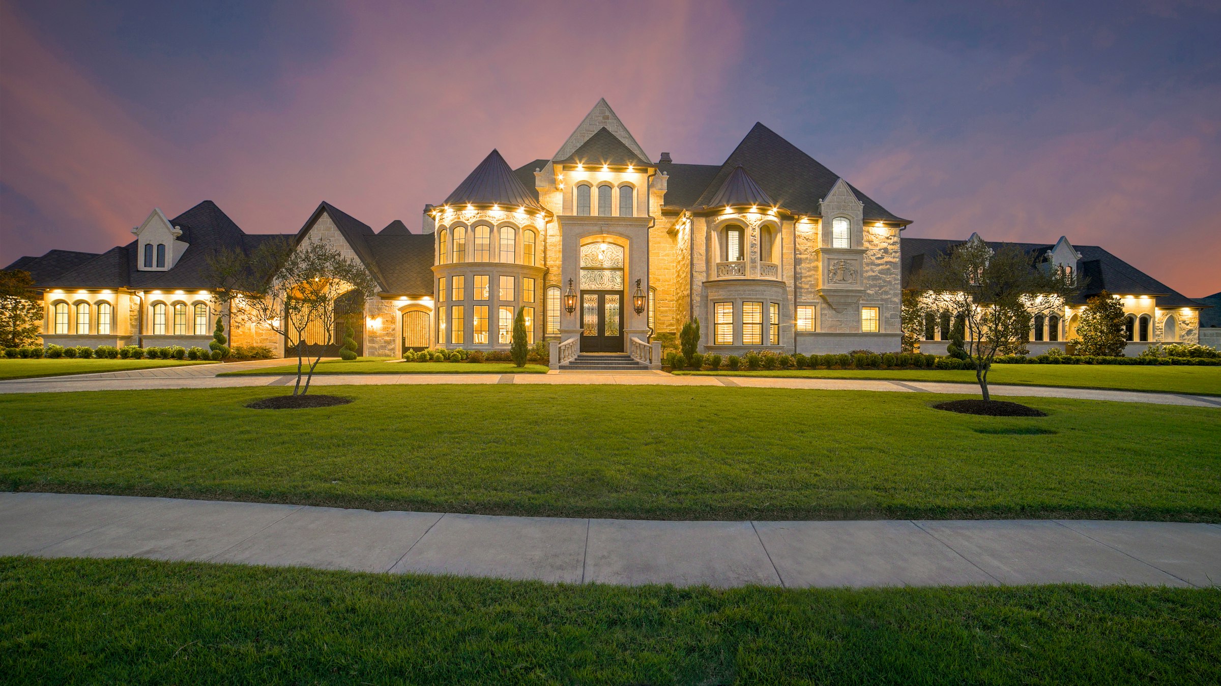 Residence at dusk with interior and exterior lighting