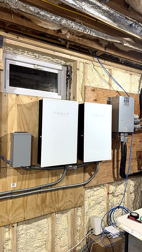 Two Tesla solar inverters installed in a Brewster, MA home