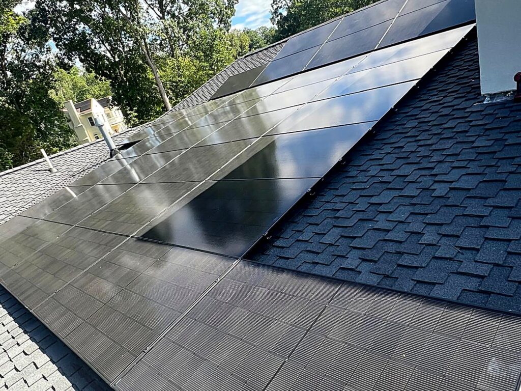 Angled view of a residential solar array on a shingle roof