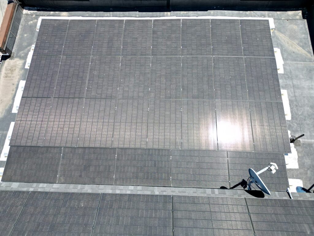 Drone view of the flat roof solar array
