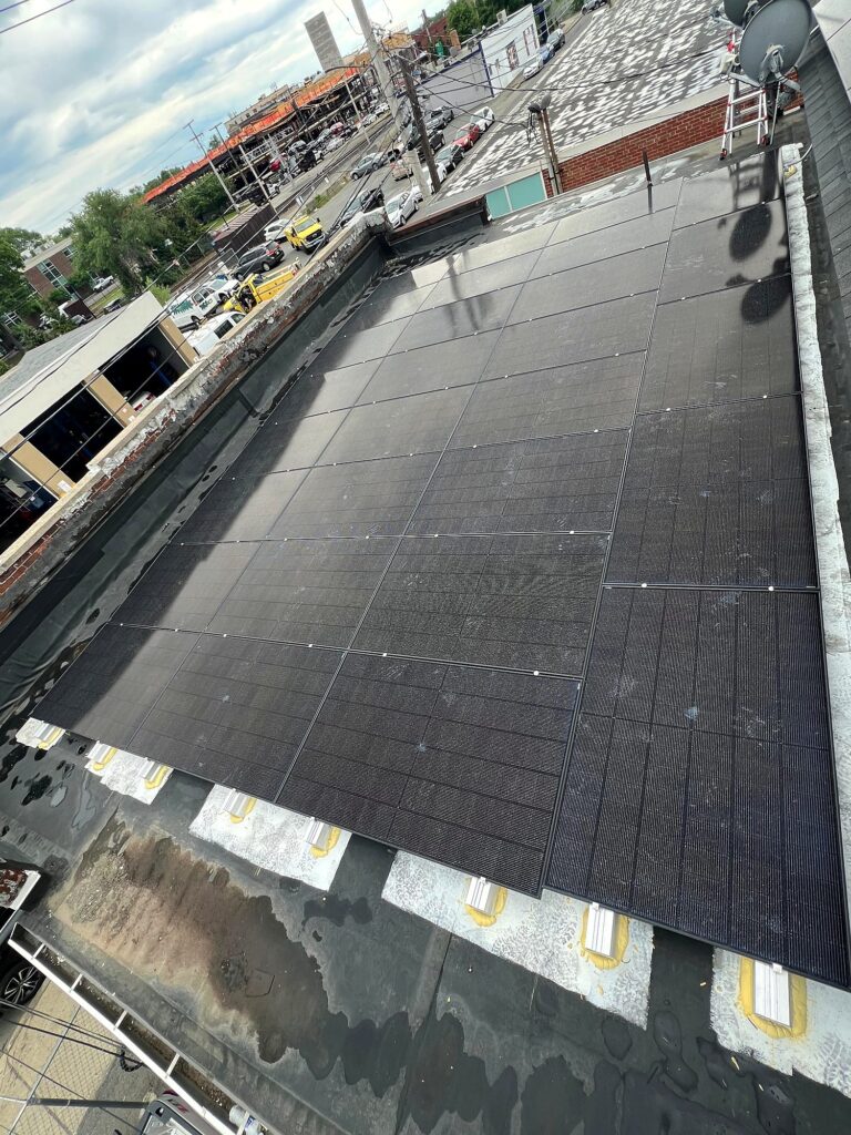 Solar array covering the flat roof of Valencia Auto Repair