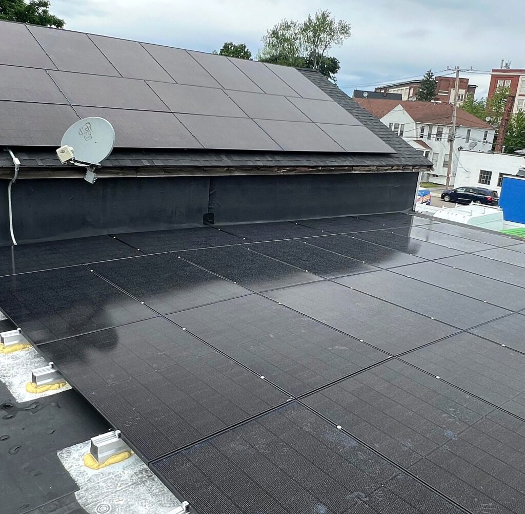 Solar modules along the pitched roof of Valencia Auto Repair